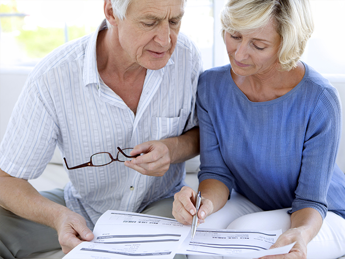 couple looking at paperwork together life insurance for retirement freedom dream team california