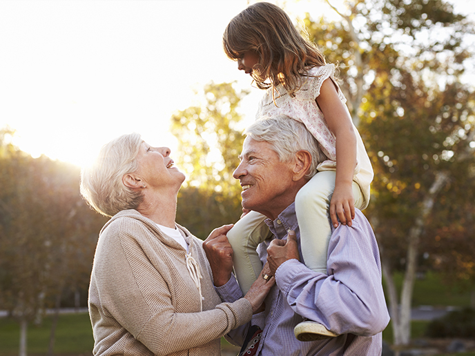 grandparents and grandchild on shoulders annuity income freedom dream team california